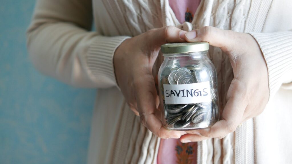 Woman holding a savings jar