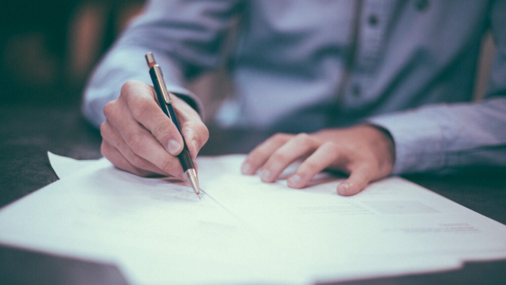 Woman signing papers